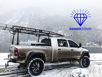 Diamond Exteriors truck all dirty from the snow